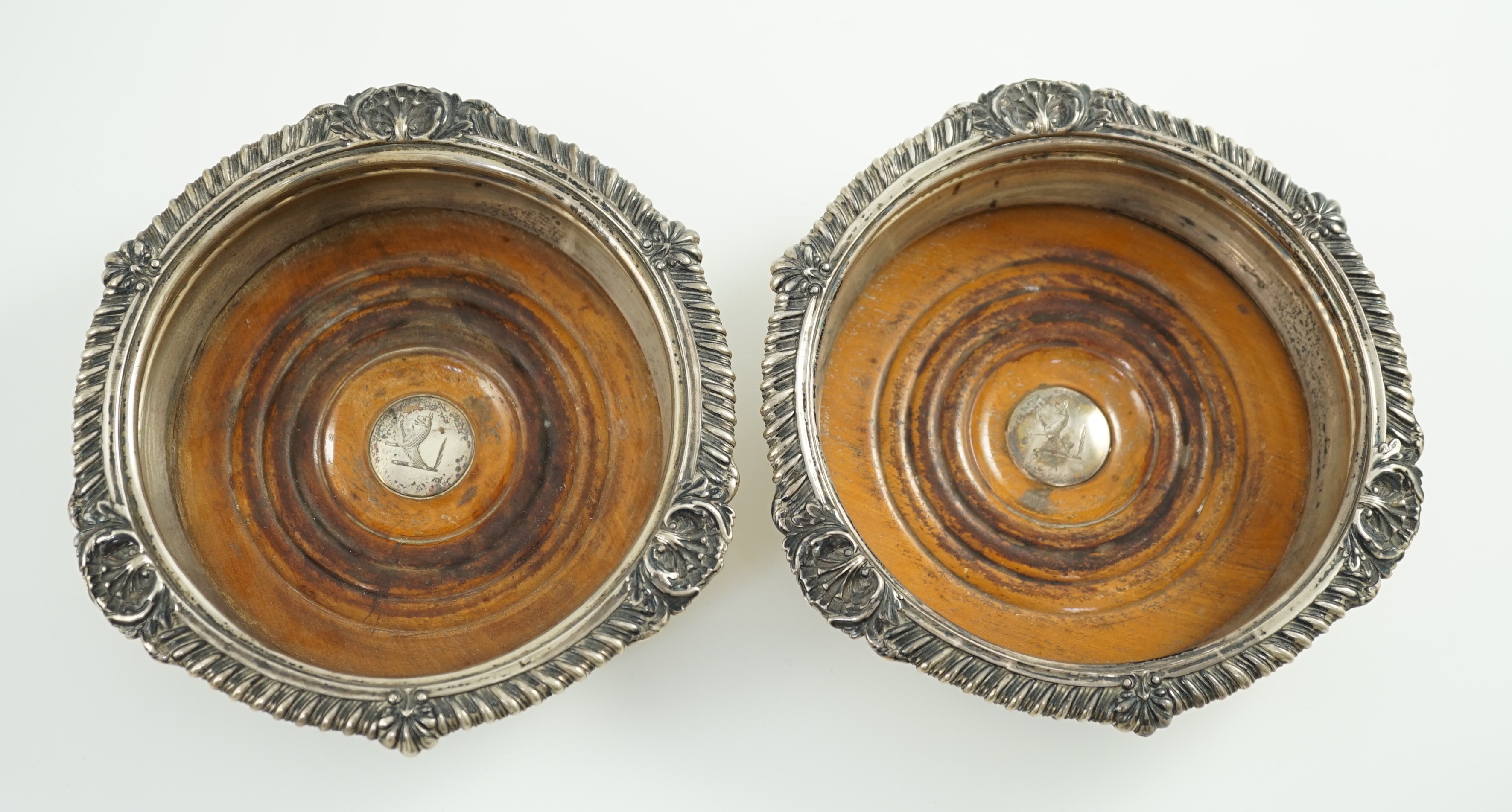 A pair of George IV silver mounted wine coasters by John Walton?
